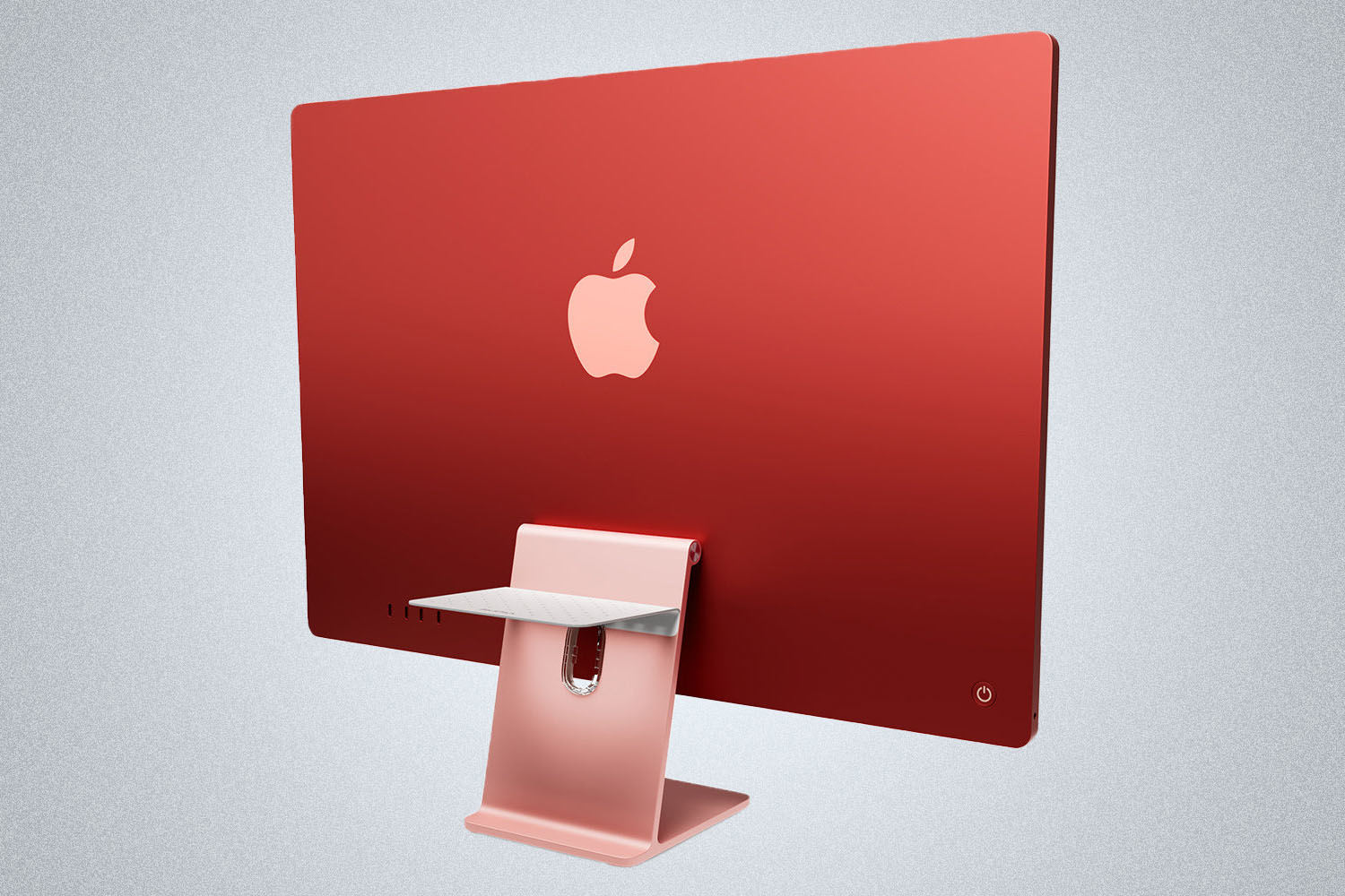 a apple iMac w/ a charging pad