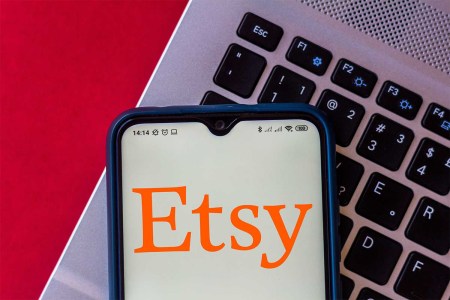 In this photo illustration the Etsy logo seen displayed on a smartphone. Here's why Etsy sellers are going on strike in April 2022.