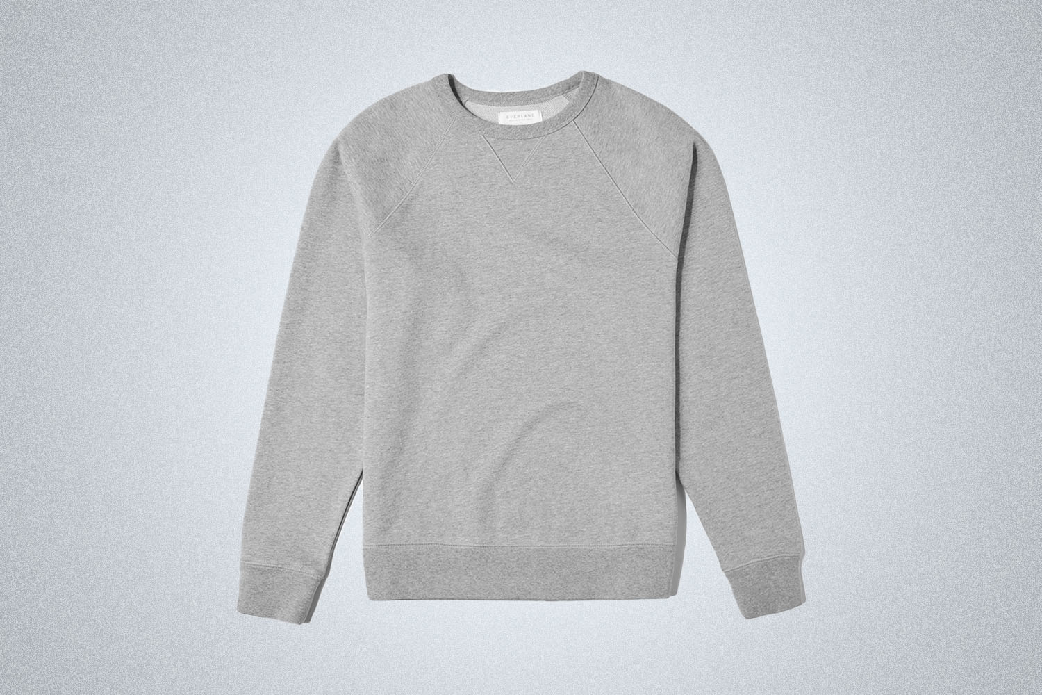 An Everlane Crewneck on a grey background