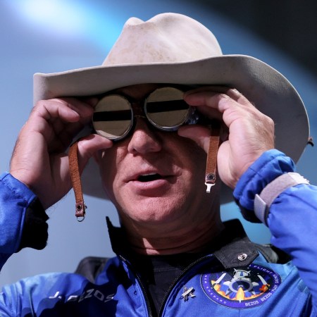 Jeff Bezos holds the aviation glasses that belonged to Amelia Earhart as he speaks during a press conference about his flight on Blue Origin’s New Shepard into space on July 20, 2021 in Van Horn, Texas.