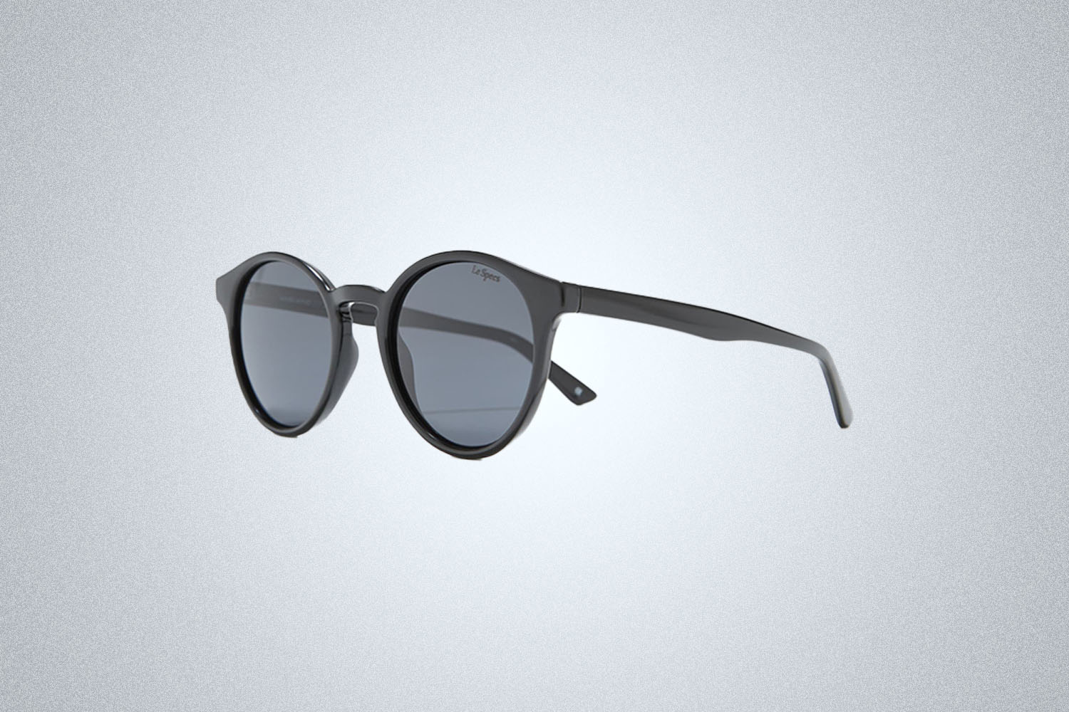 a pair of sunglasses on a grey background