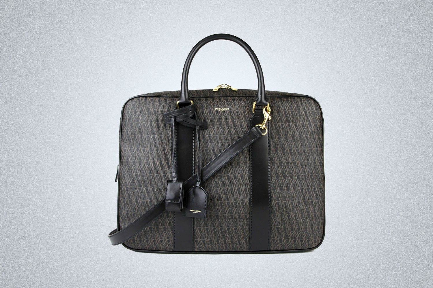 a YSL briefcase on a grey background