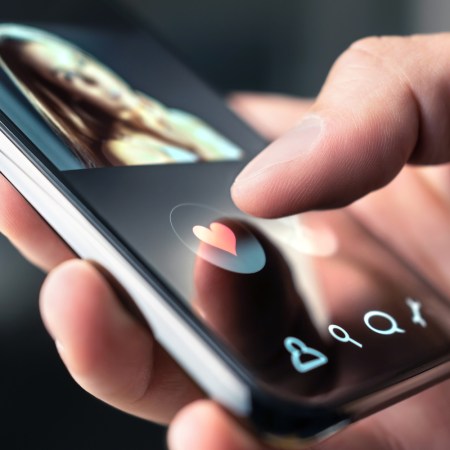 Online dating app in mobile phone. Like or swipe to match. Single man looking for love and relationship with smartphone. Woman with beautiful profile picture on internet site