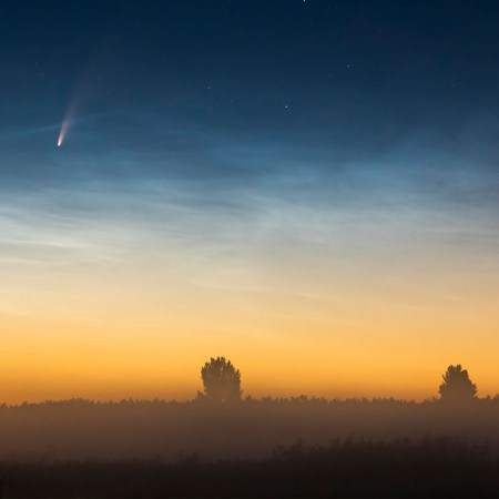 A comet flying past Earth.