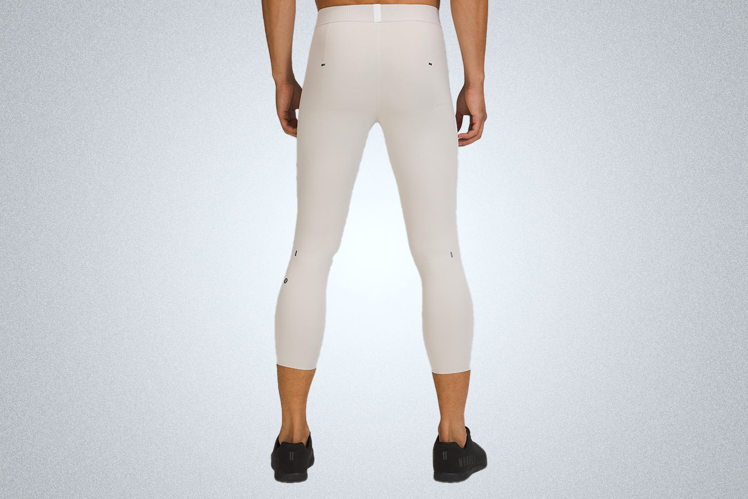 A pair of tan tights on a model
