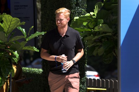 Reddit CEO Steve Huffman walking along the sidewalk.