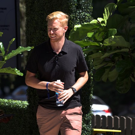 Reddit CEO Steve Huffman walking along the sidewalk.
