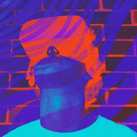 A person wearing a VR headset, an imagined present/future of the "metaverse"