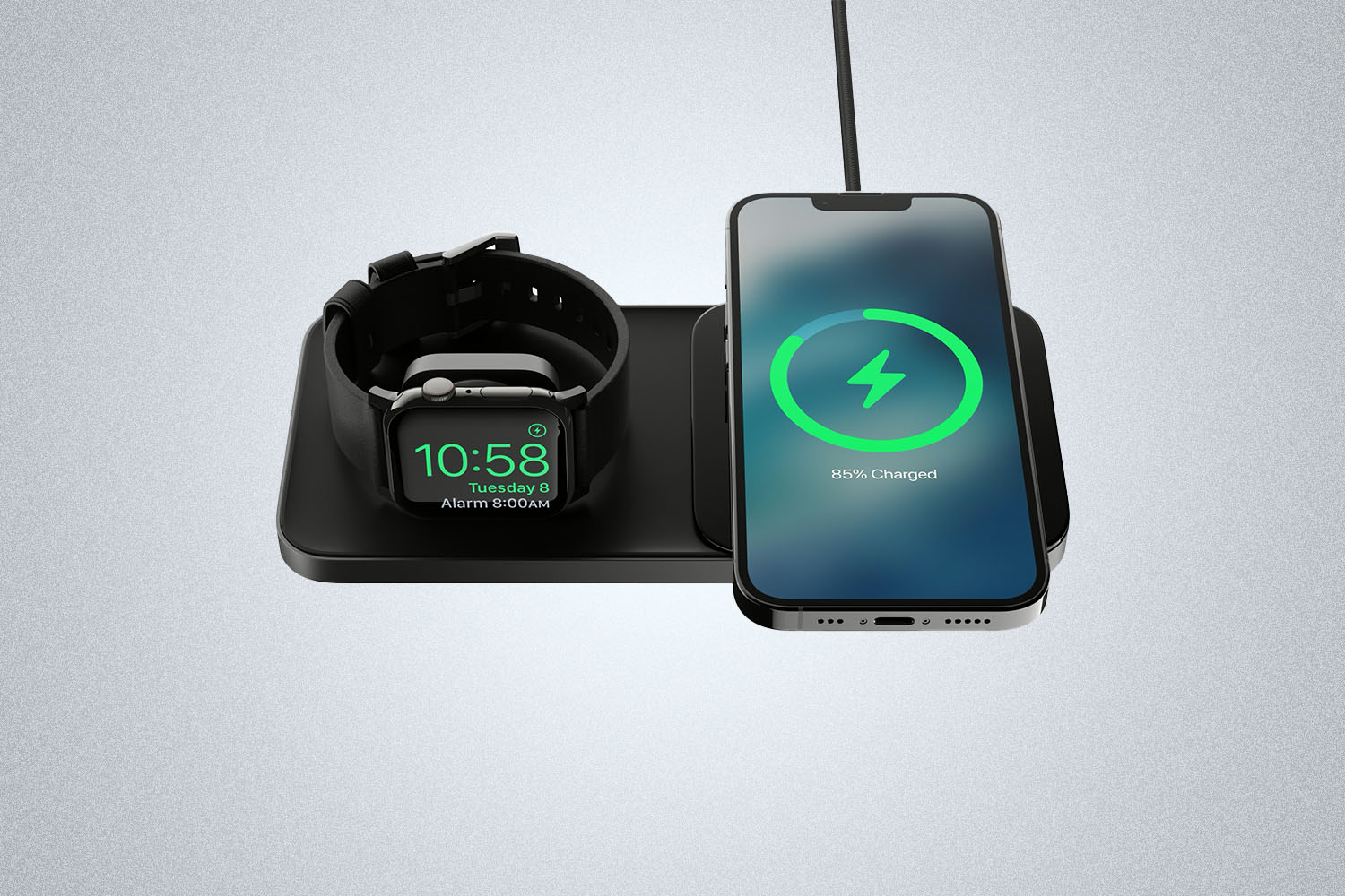 a phone and a watch on a charger