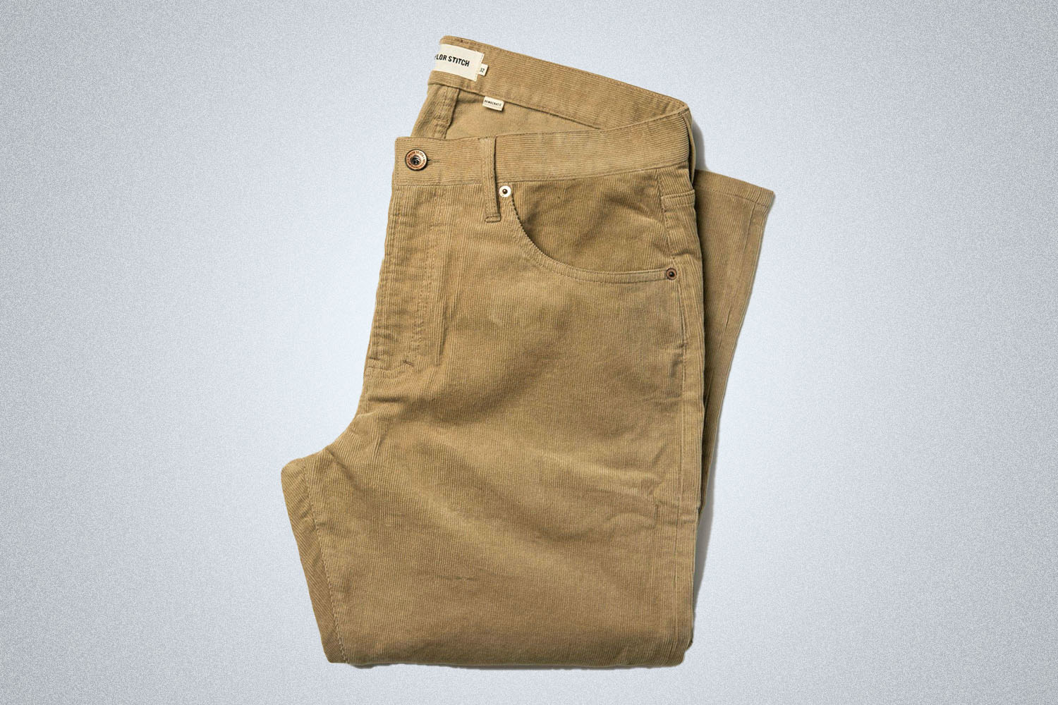 Taylor Stitch apparel on a grey background