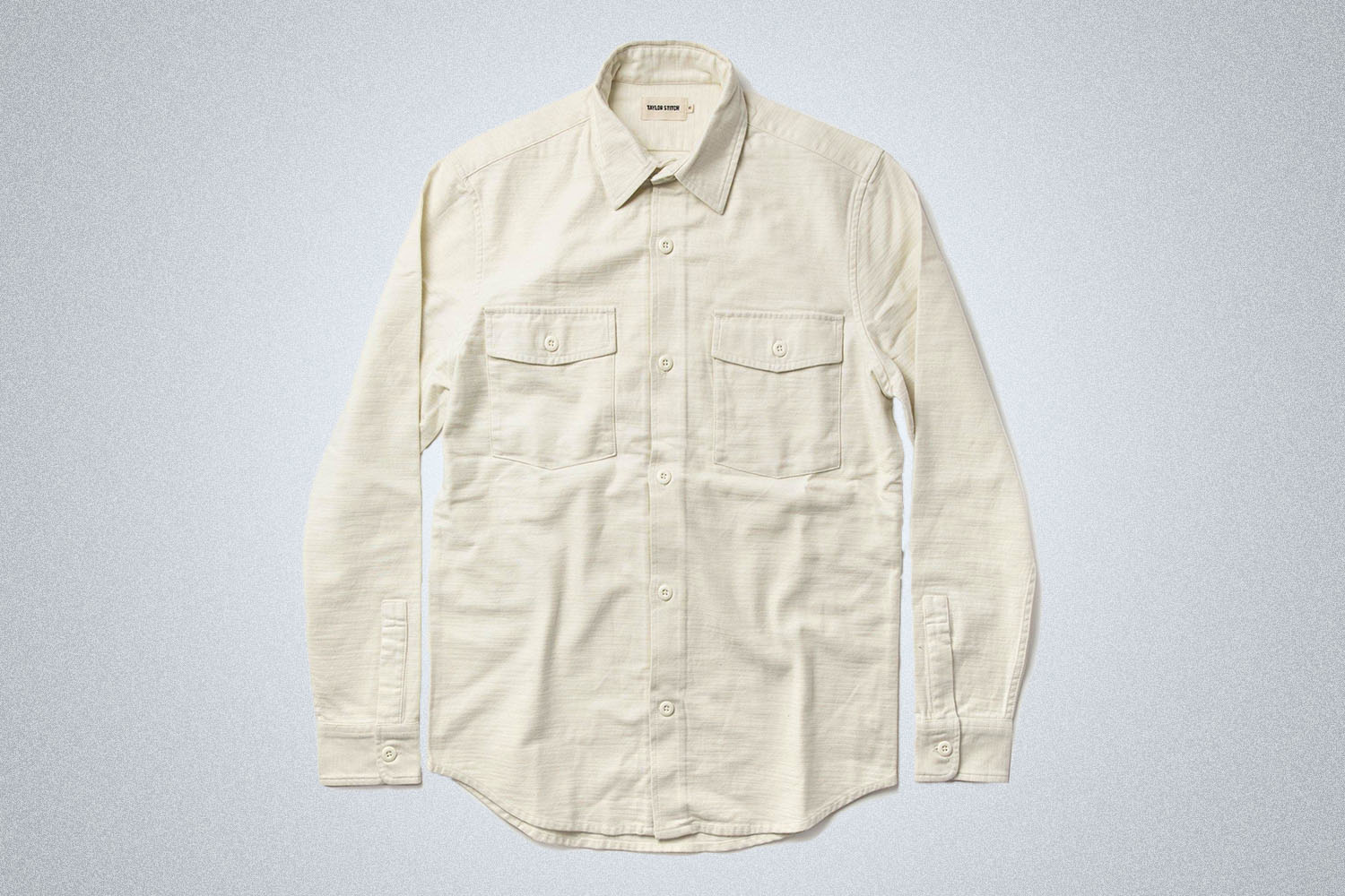 Taylor Stitch apparel on a grey background