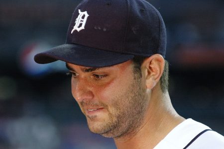 Armando Galarraga talks to the press after losing his perfect game in 2010. A law class is pressuring the MLB to award the pitcher a perfect game.