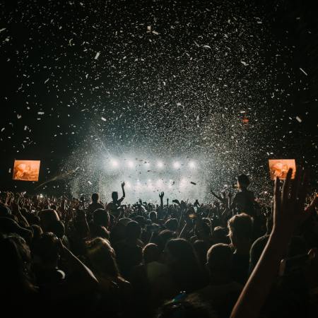 An indoor shot of a crowded concert. Recent online debate has centered on people talking during concerts.