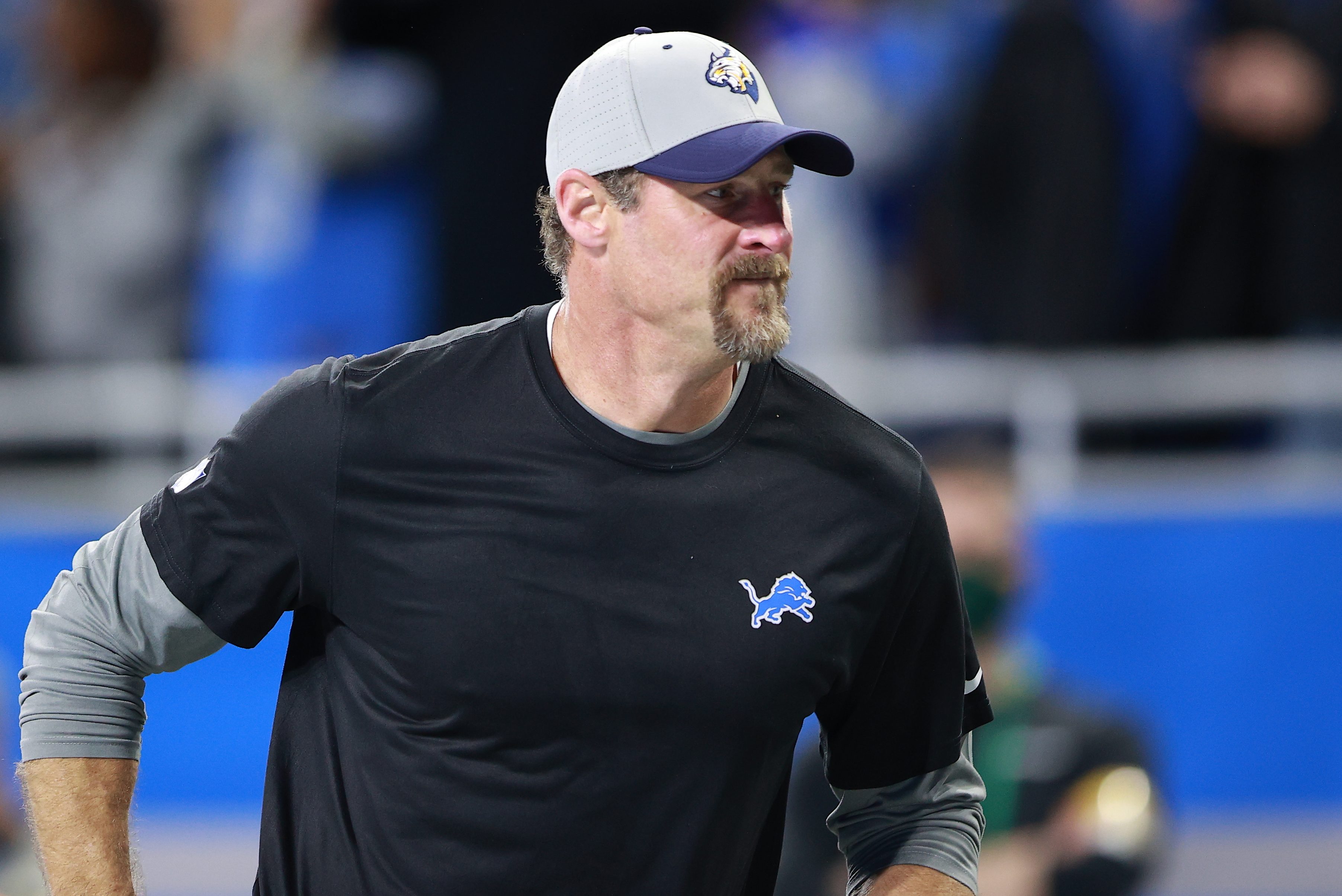 Head coach Dan Campbell of the Detroit Lions walks off the field after a win