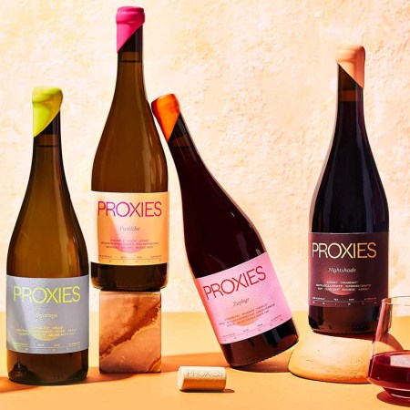 Four bottles of "Proxies" by Acid League, a non-alcoholic wine brand