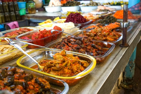 Yalta, Crimea. Products of the Yalta market, pickles of vegetables on the counter for sale.