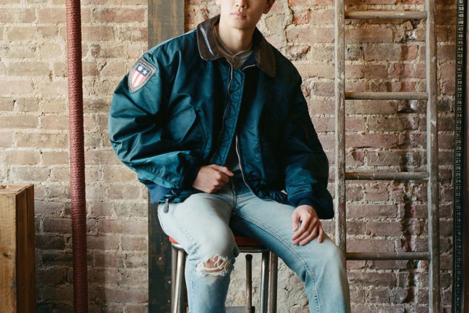 A model in a vintage Alpha Industries Jacket