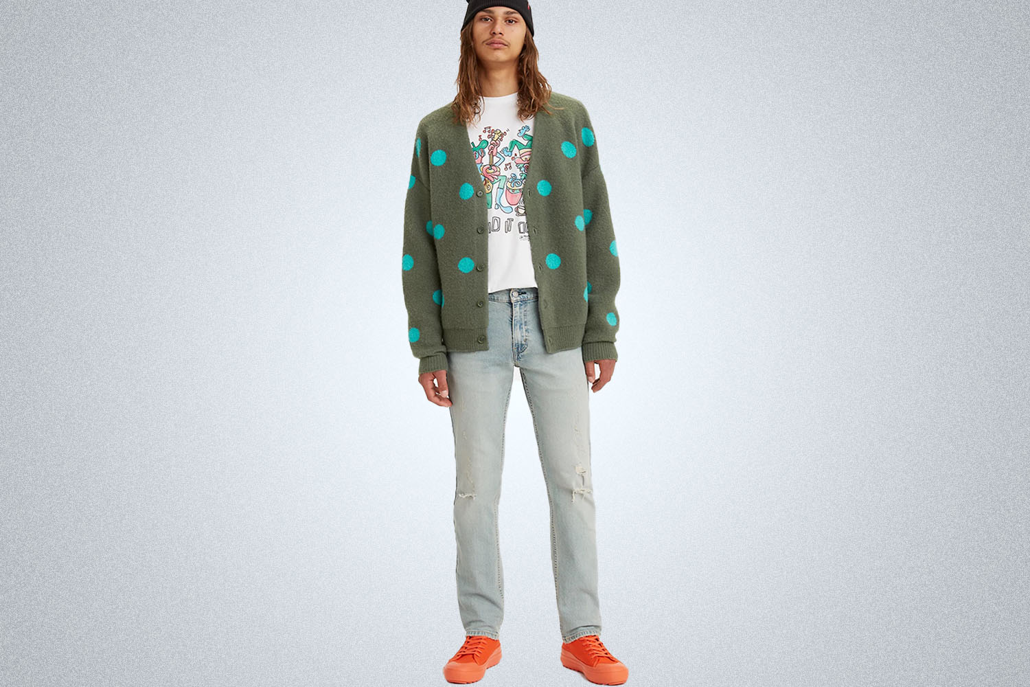 A model wearing Levi's apparel on a grey background
