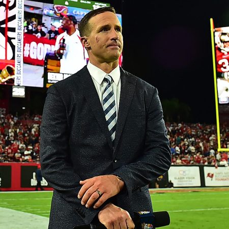 Drew Brees stands on the sideline during a game between the Buccaneers and the Cowboys