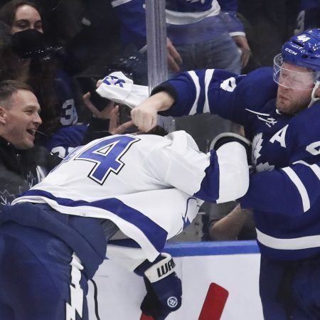 Morgan Rielly of the Toronto Maple Leafs and Jan Rutta of the Tampa Bay Lightning battle it out