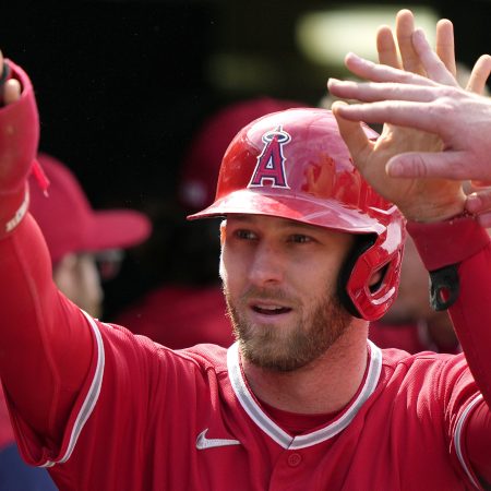 Taylor Ward of the Los Angeles Angels is congratulated by his teammates after scoring
