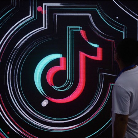 The TikTok logo on a screen.