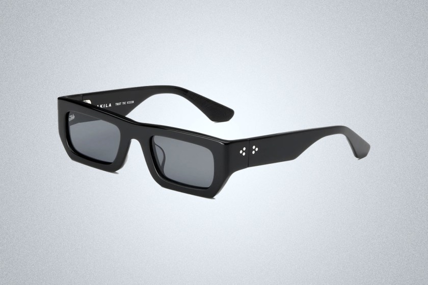 a pair of black polaris akila sunglasses on a grey background