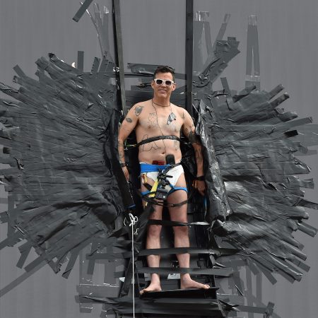 Steve-O duct-tapes himself to a billboard