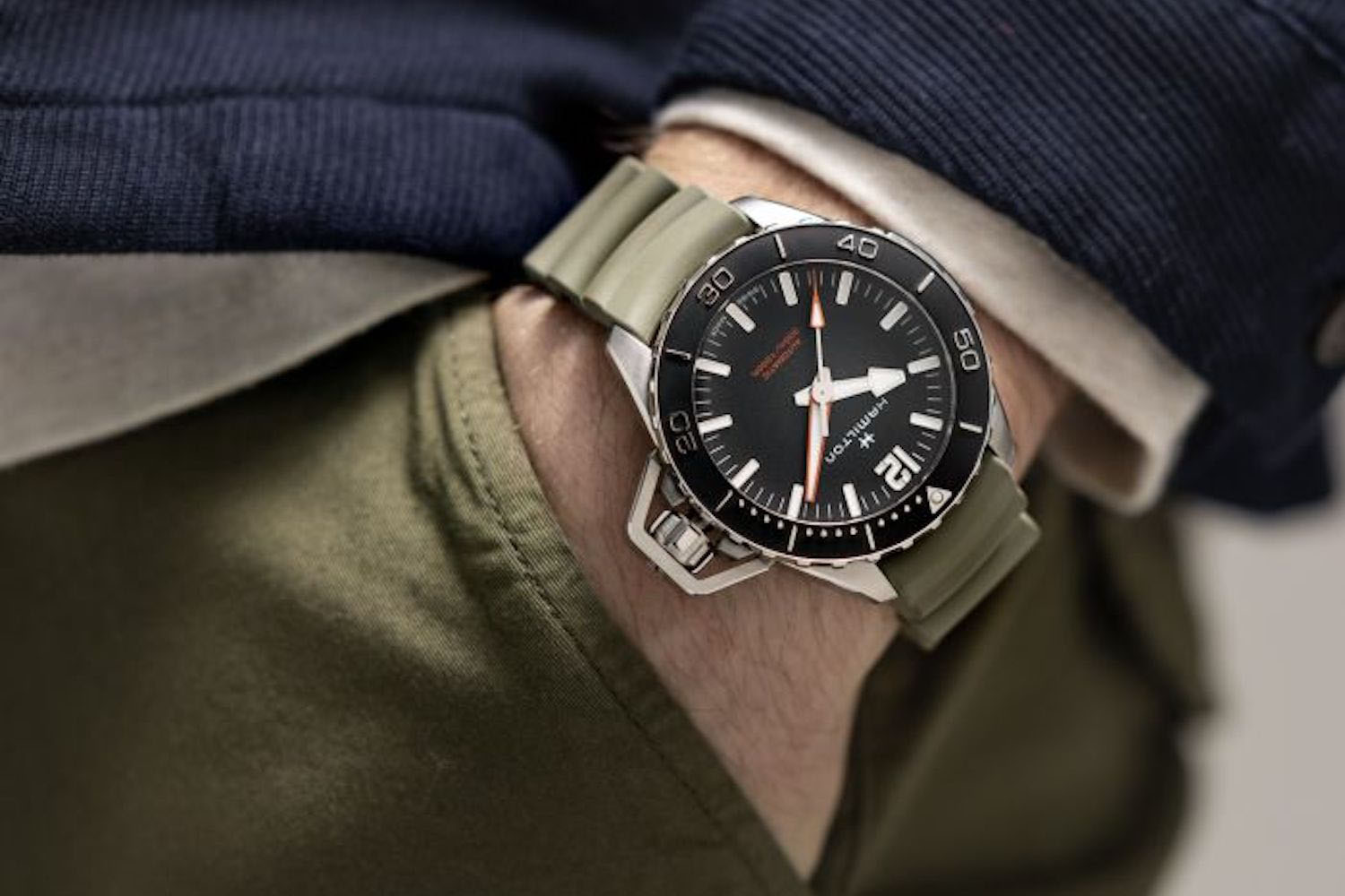 a close up, on wrist shot of the Manilton Frogman Auto Watch with green strap