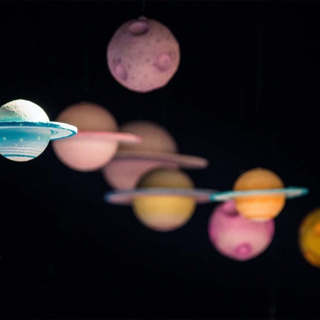 A bunch of planets on a black background. A new research paper looks at the possibility of aliens using rogue planets to travel around space.