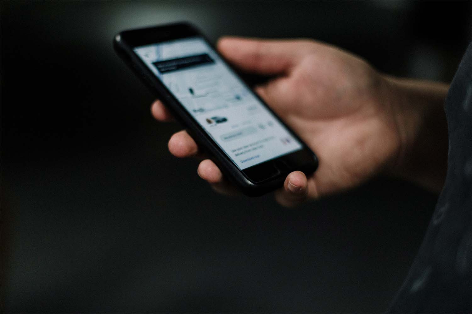 Uber app being using on an iPhone