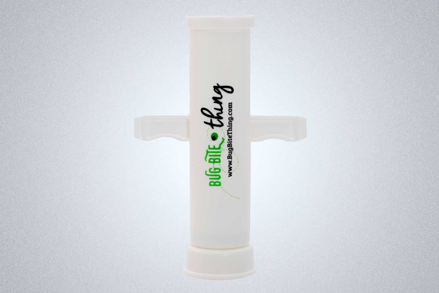 a white tik remover from REI on a grey background