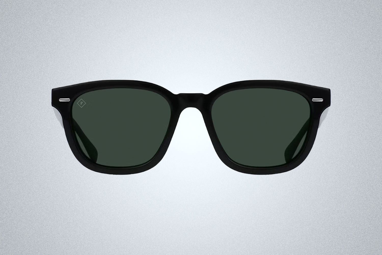 A pair of black Raen Optics sunglasses on a grey background