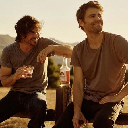 Actors turned whiskey blenders Ian Somerhalder and Paul Wesley with a bottle of their Brother's Bond bourbon
