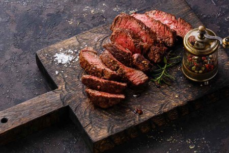 A sliced open steak from Crowd Cow on a serving platter
