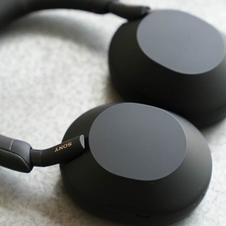 The black Sony WH-1000XM5 headphones lying on a table
