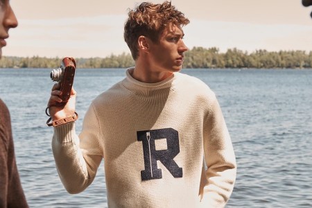 a model wearing the new J.Crew Fall 2022 collection in front of a lake