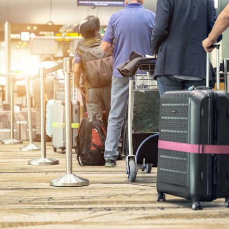 Travelers waiting in line at an airport