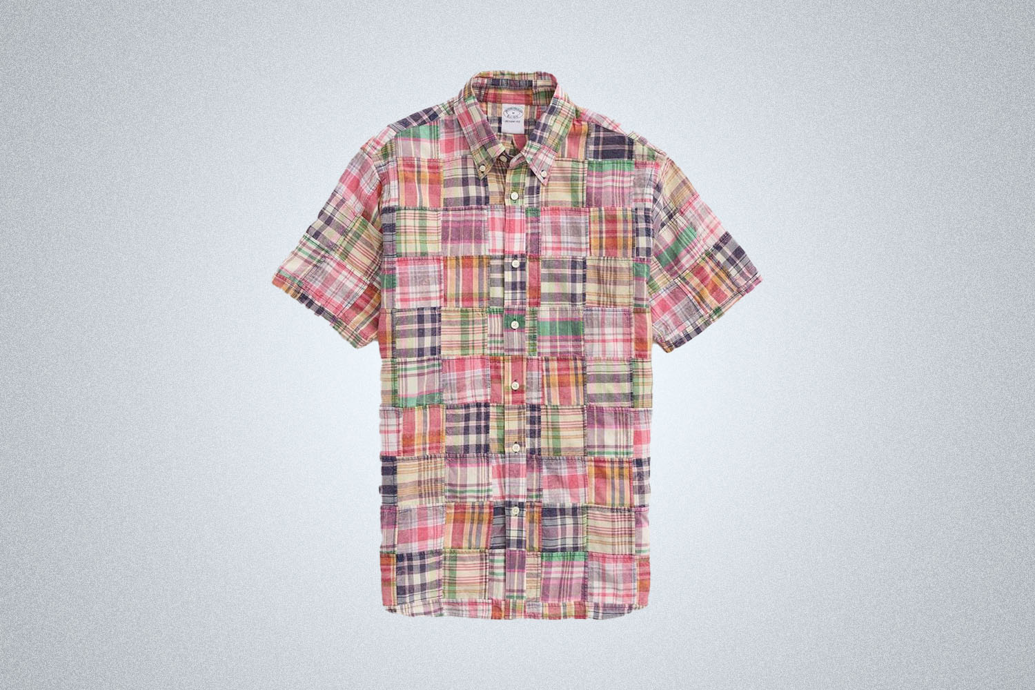 a patchwork madras shirt from Brooks Brothers on a grey background