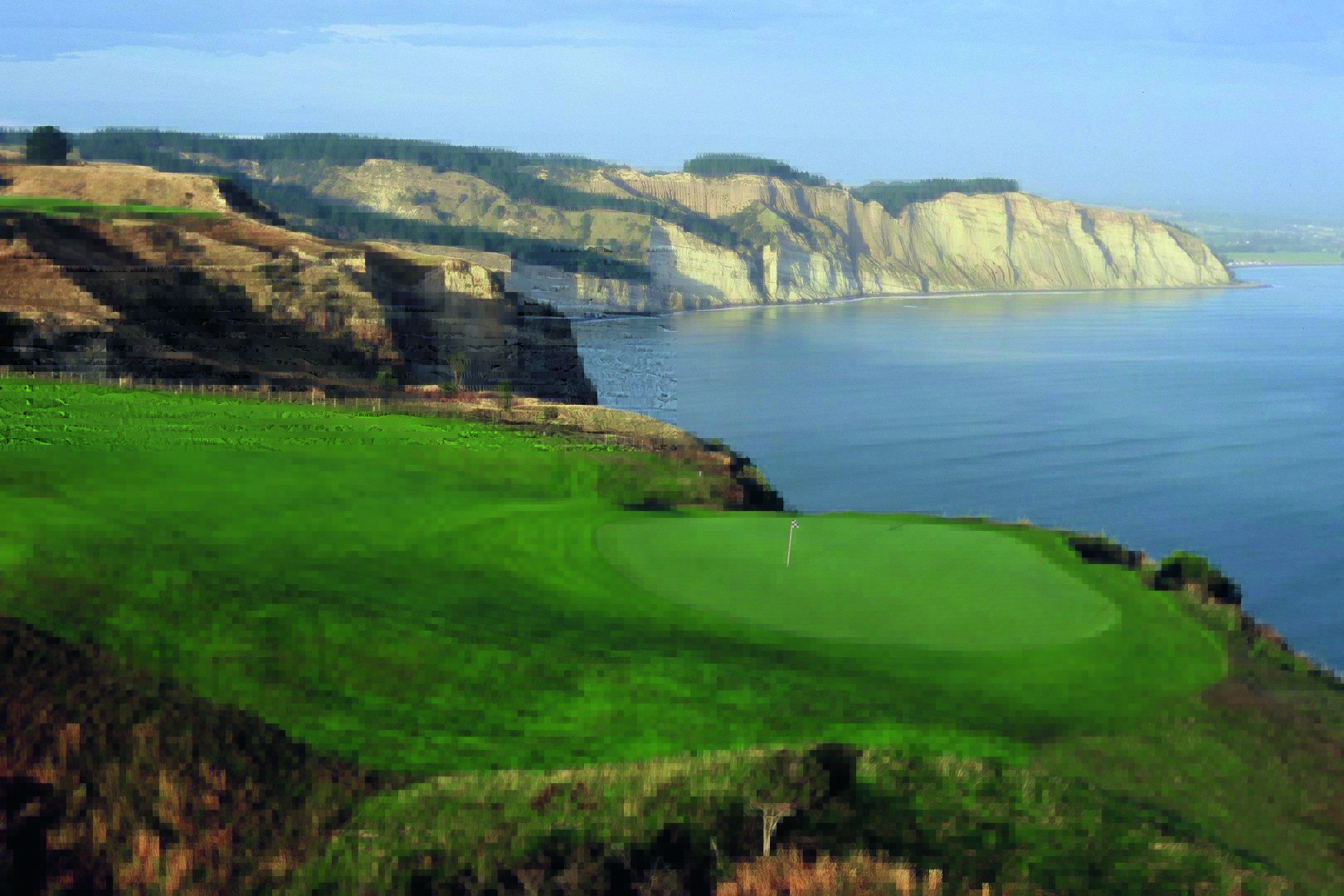 <strong>CAPE KIDNAPPERS</strong>, New Zealand. The back nine is built on top of precipitous “fingers” of land that stretch out some 460 feet above the sea.<br><br>Waldek says: "Designer Tom Doak set the back nine holes atop narrow slivers of land, between which are steep cliffs that drop 460 feet into Hawke’s Bay. This course is not for the faint of heart, although admittedly it appears far more intimidating from the air than it does from the fairways or greens."<br>