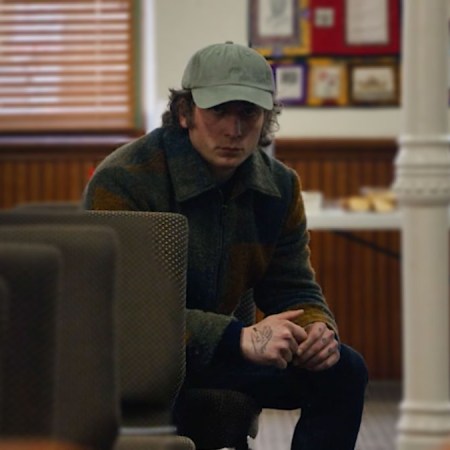 a enhanced photo of Carmy fromFX's The Bear in a wool jacket
