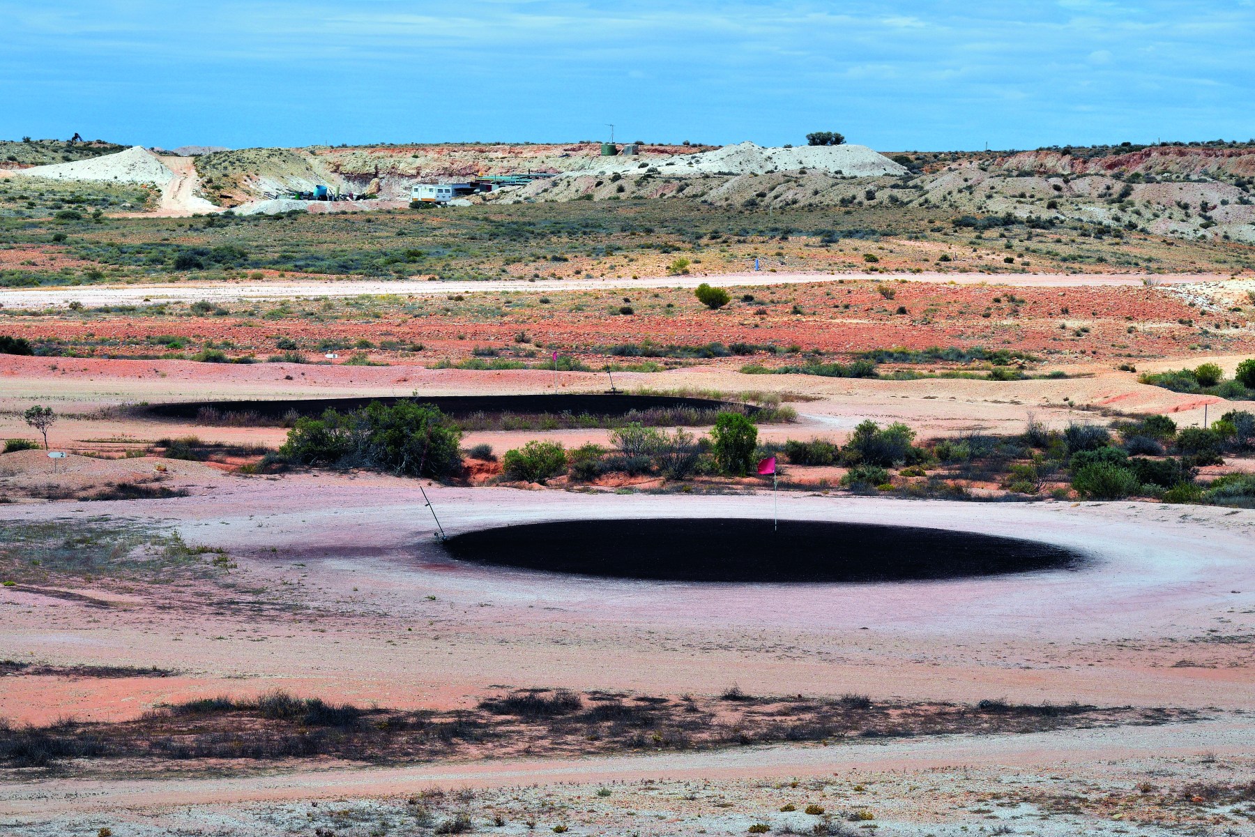 <strong>COOBER PEDY OPAL FIELDS GOLF CLUB</strong>, Australia. There’s no grass at this unusual course, which is the only one in the world to have reciprocal rights for its members to play at the Old Course at St. Andrews in Scotland.<br><br>Waldek says: “Coober Pedy is a rather unusual place for a golf course, but the local residents — many of whom live underground to escape the heat — have built their own grass-free golf course. It is played during the cooler winters or on summer evenings. Instead of fairways, it has white sandstone and instead of greens, it has scrapes made from a mixture of quarry dust and waste oil.”<br>