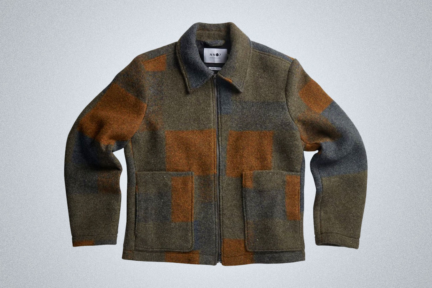 a checked wool zip jacket on a grey background