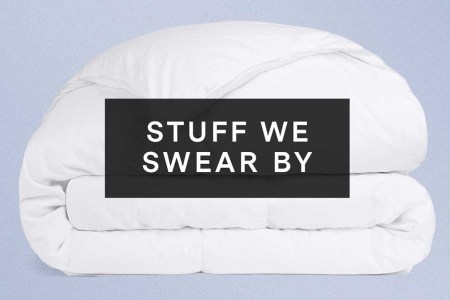 Parachute's Duvet Insert overlaid with "Stuff We Swear By" on a purple background