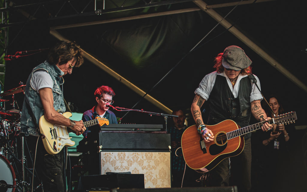 Johnny Depp performs on stage with Jeff Beck during the Helsinki Blues Festival at Kaisaniemen Puisto on June 19, 2022.