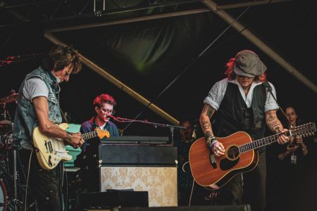 Johnny Depp performs on stage with Jeff Beck during the Helsinki Blues Festival at Kaisaniemen Puisto on June 19, 2022.