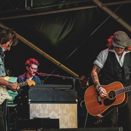 Johnny Depp performs on stage with Jeff Beck during the Helsinki Blues Festival at Kaisaniemen Puisto on June 19, 2022.