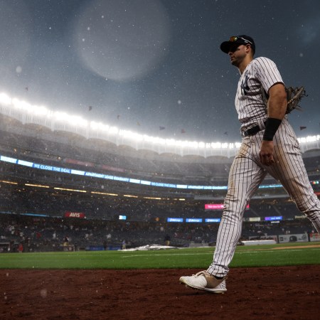 Joey Gallo walks off the field at Yankee Stadium during a rain delay.
