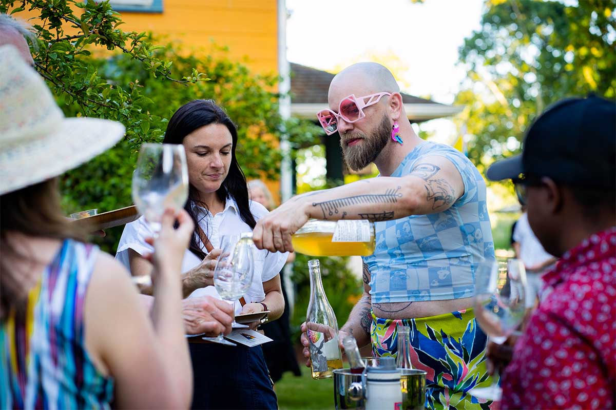 Luke of Statera Cellars pours tastes of his Aligote and Chardonnay
