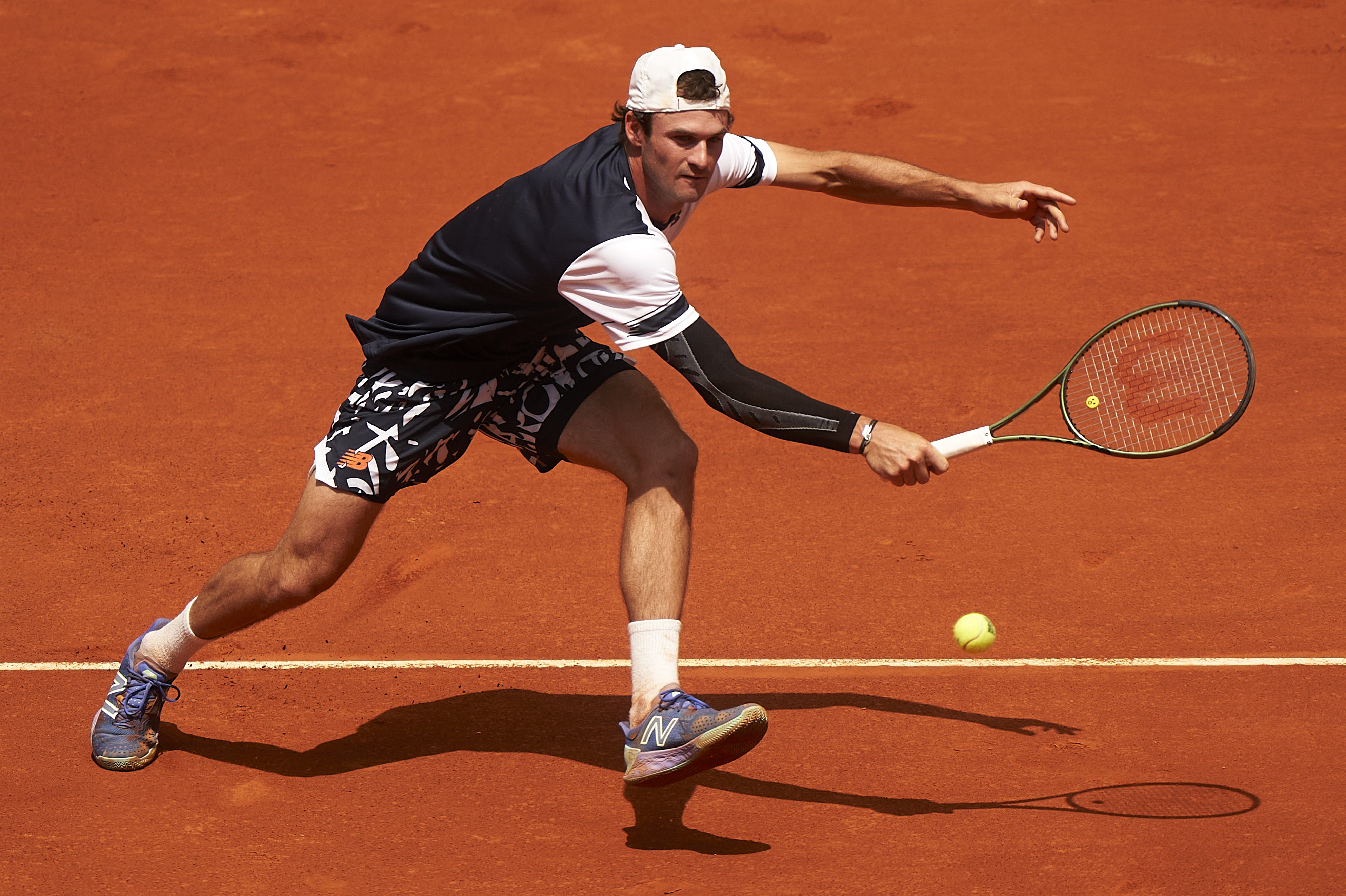 Tommy Paul of the U.S. returns a ball to Jannik Sinner of Italy.